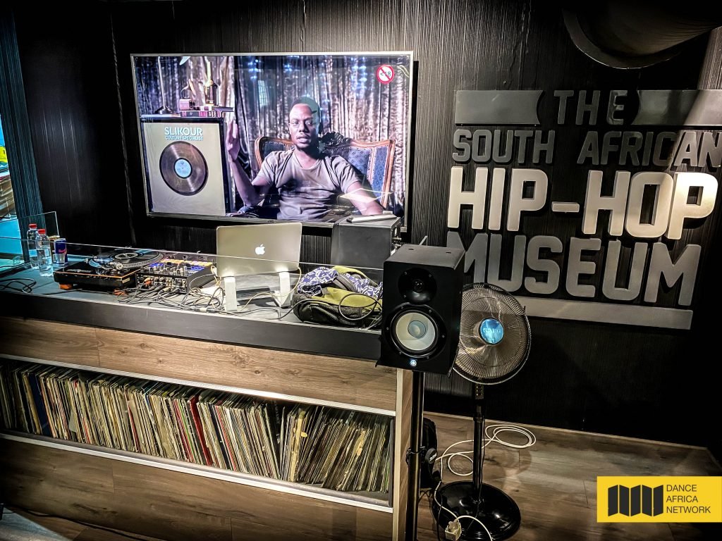 The South African Hip Hop Museum Media Launch 3 February 2022 in Newtown This is the DJ area that has some cool old vinyls and a TV diplaying interviews with legends and the logo of the museum on the right
